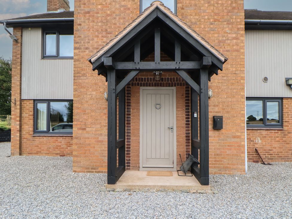 An outdoor entrance with a front door and gravel at Rook Hall Farm Butterton near Newcastle-Under-Lyme