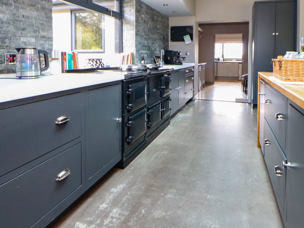 A kitchen with cabinets and an oven at Rook Hall Farm Butterton near Newcastle-Under-Lyme