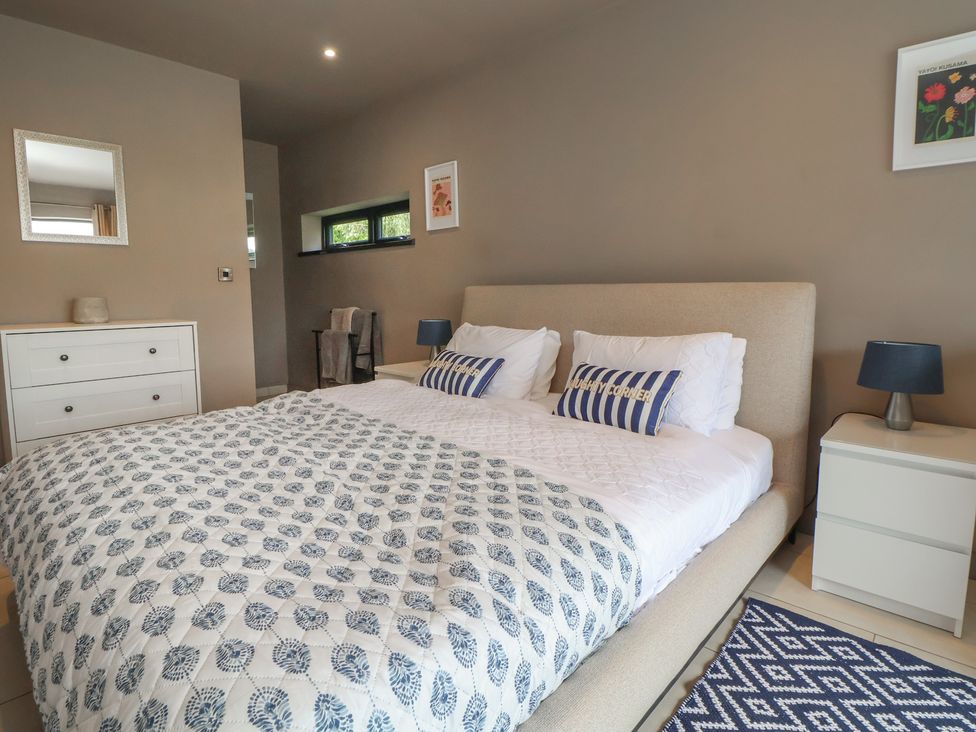 A bedroom with a bed and drawer unit at Rook Hall Farm Butterton near Newcastle-Under-Lyme