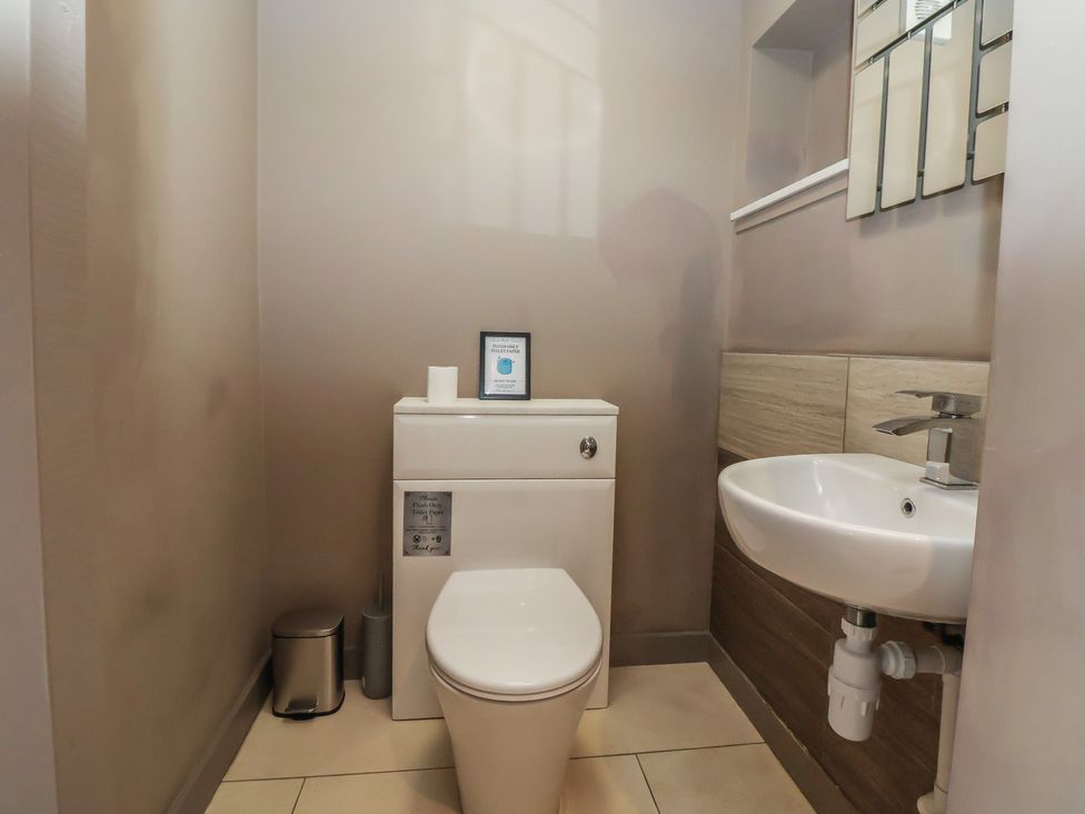 A bathroom with a toilet and sink at Rook Hall Farm Butterton near Newcastle-Under-Lyme