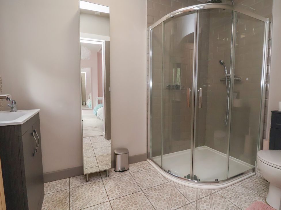 A bathroom with a shower and sink at Rook Hall Farm in Butterton near Newcastle-Under-Lyme