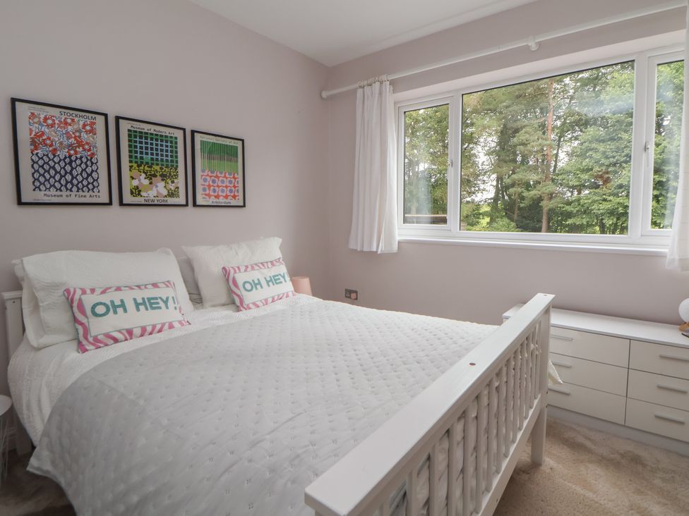 A bedroom with a bed and wall art at Rook Hall Farm Butterton near Newcastle-Under-Lyme