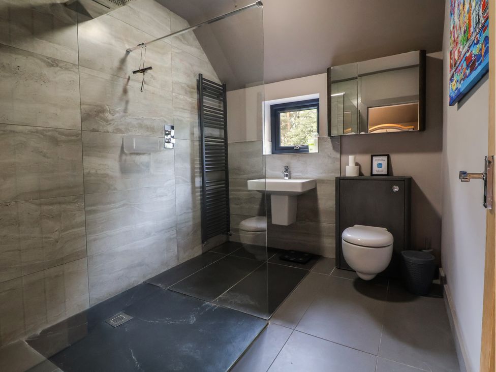 A bathroom with a shower, sink, and toilet at Rook Hall Farm in Butterton near Newcastle-Under-Lyme