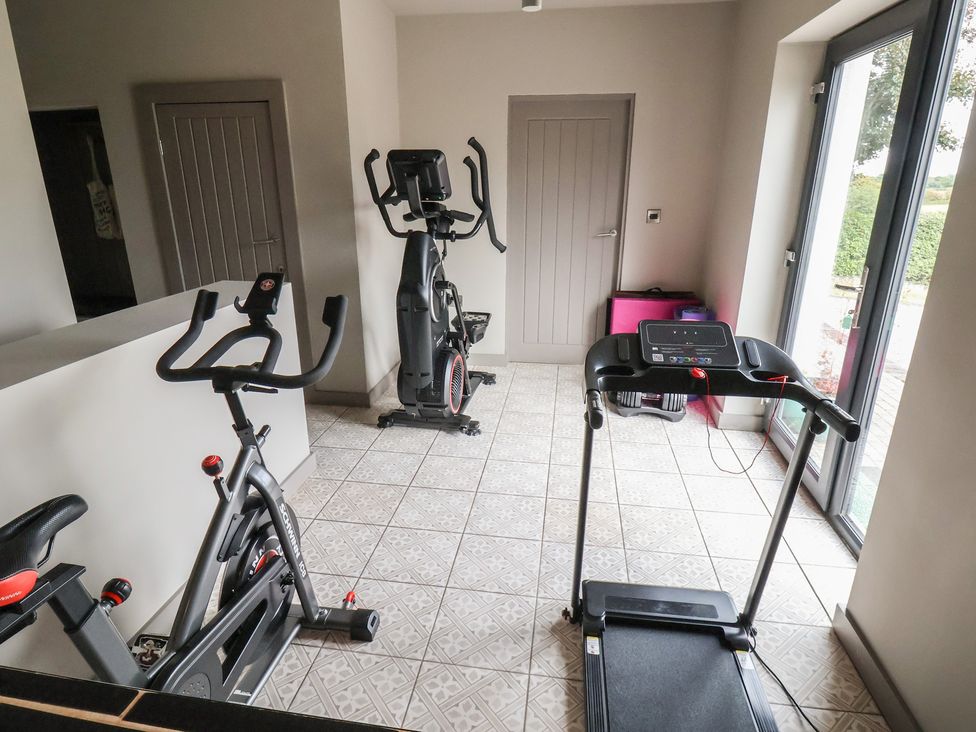 A home gym with exercise equipment at Rook Hall Farm Butterton near Newcastle-Under-Lyme