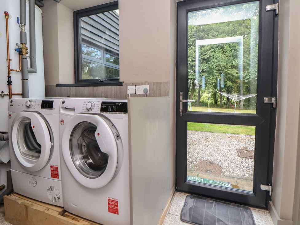 A laundry room with washing machine and dryer at Rook Hall Farm Butterton near Newcastle-Under-Lyme