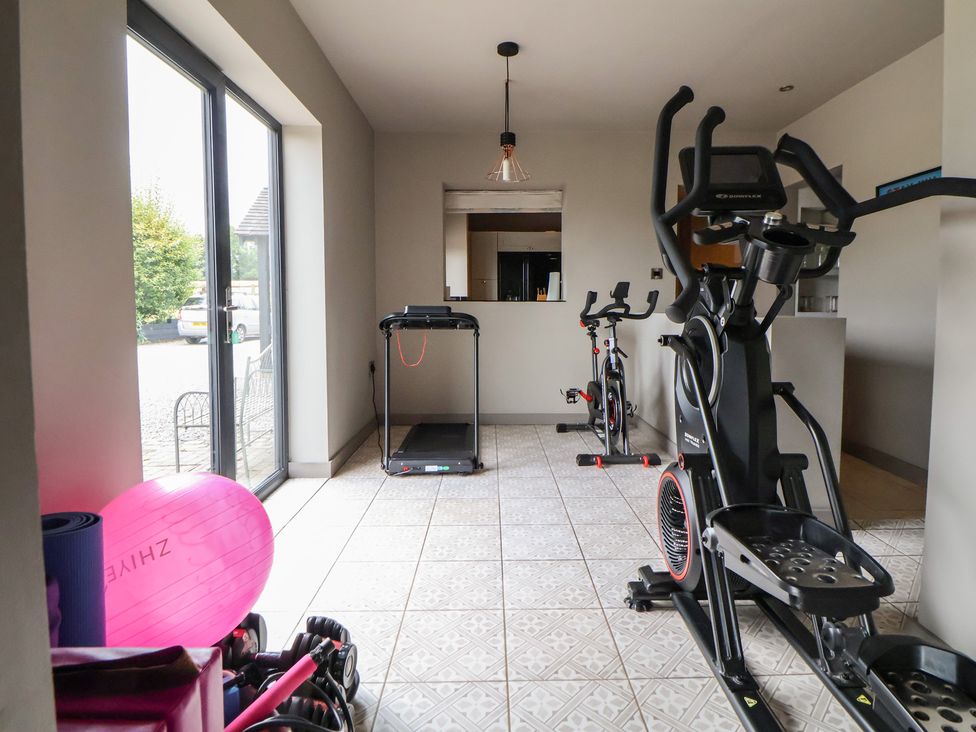 A gym with exercise equipment at Rook Hall Farm Butterton near Newcastle-Under-Lyme