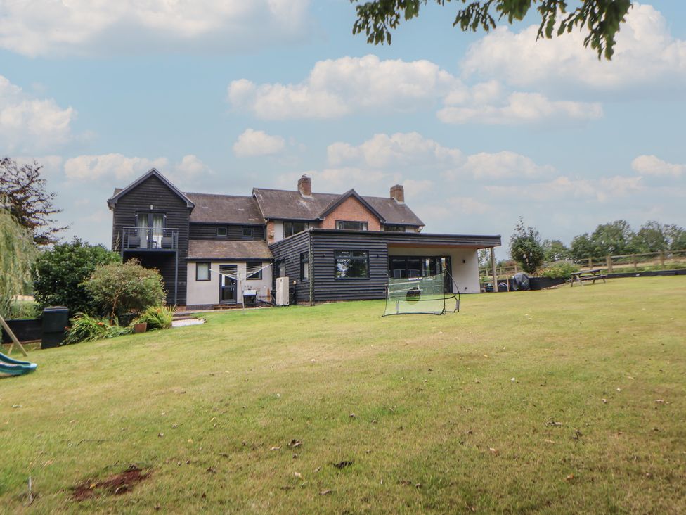A house with a garden and balcony at Rook Hall Farm Butterton near Newcastle-Under-Lyme