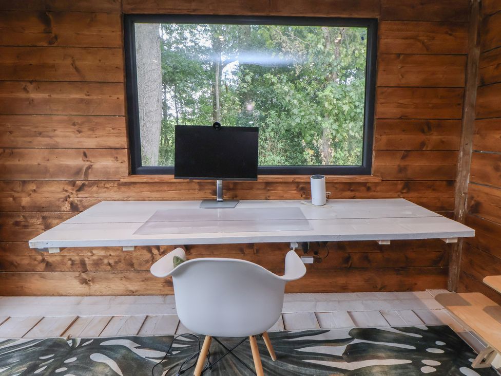 An office with a desk and monitor at Rook Hall Farm Butterton near Newcastle-Under-Lyme