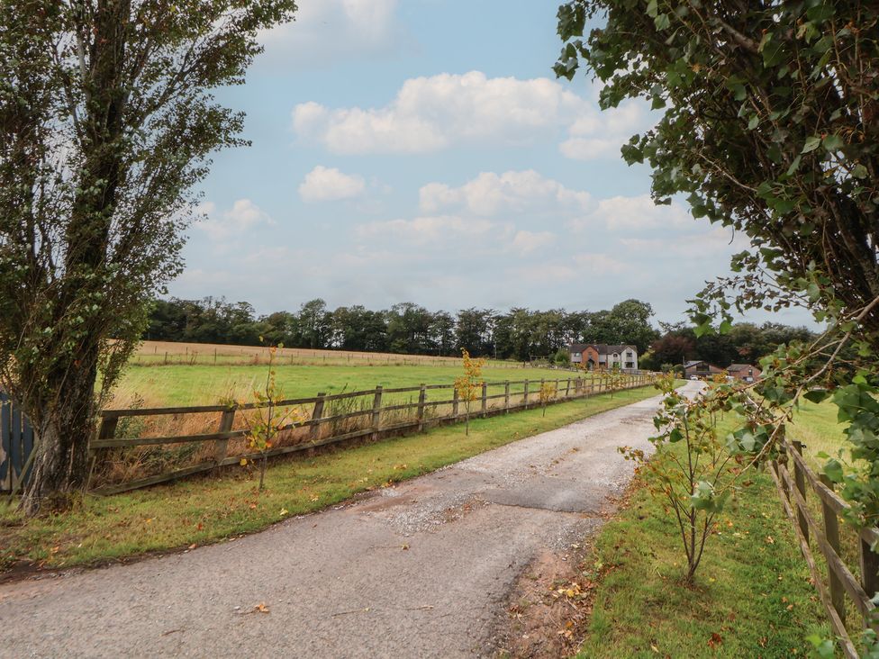 A road leading to a house surrounded by fields at Rook Hall Farm in Butterton near Newcastle-Under-Lyme