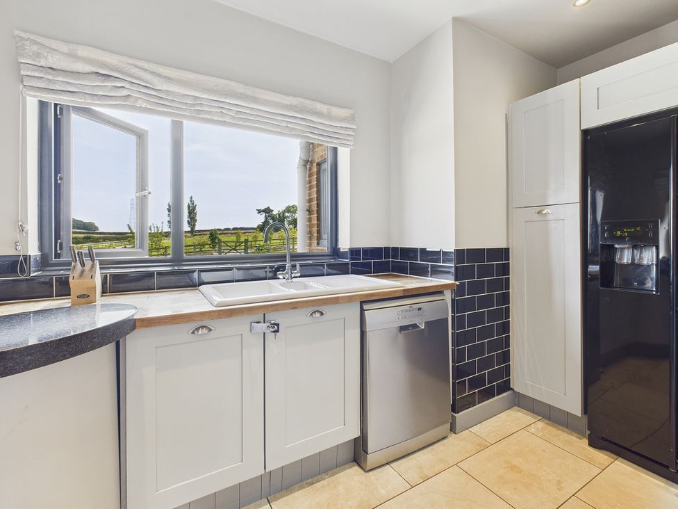 A kitchen with a sink and dishwasher at Rook Hall Farm Butterton near Newcastle-Under-Lyme