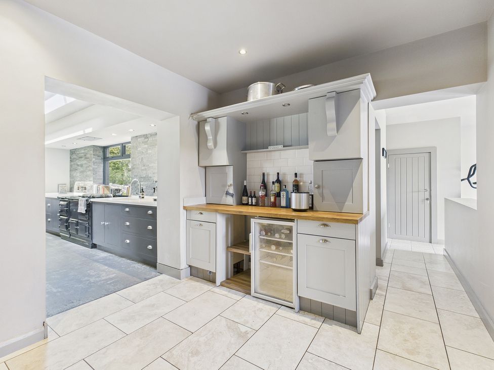 A kitchen with a wine fridge and counter at Rook Hall Farm Butterton near Newcastle-Under-Lyme