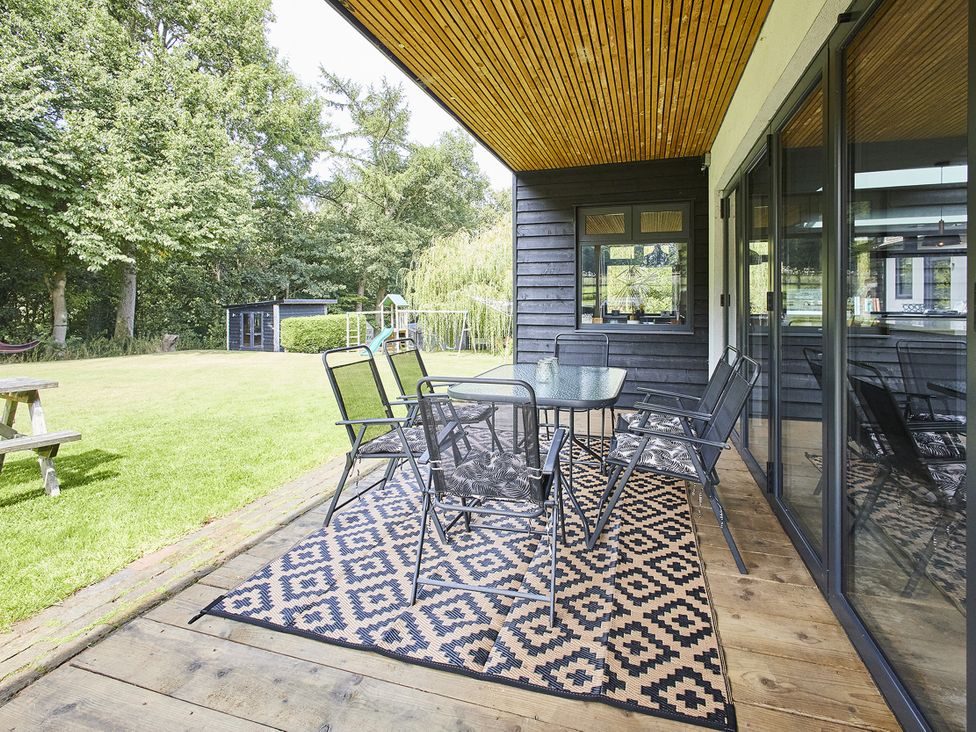 An outdoor area with a table and chairs at Rook Hall Farm Butterton near Newcastle-Under-Lyme
