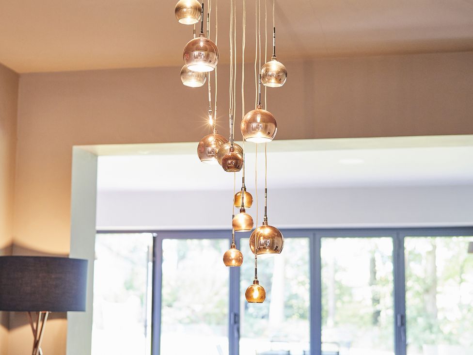 A hanging light fixture with multiple bulbs at Rook Hall Farm near Newcastle-Under-Lyme