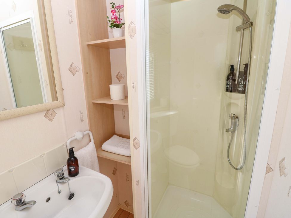 A bathroom with a sink and shower at Number 38 in Chichester