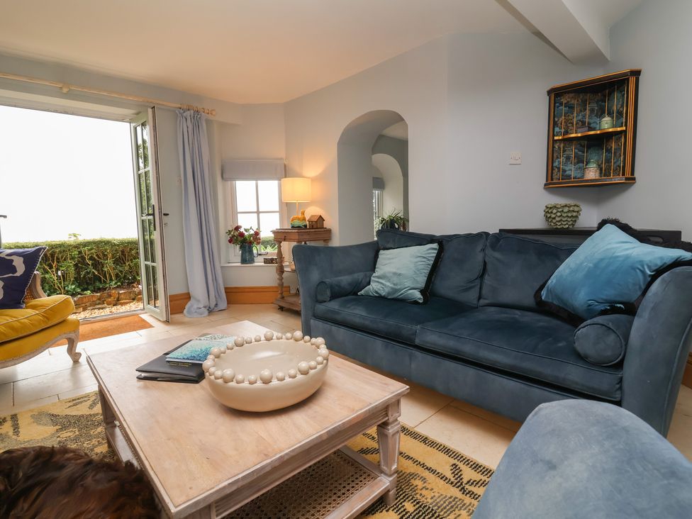 A living room with a sofa and coffee table at Rookery Cottage in Lynton