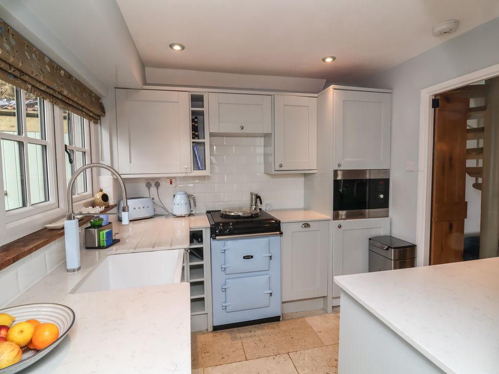 A kitchen with appliances and a sink at Rookery Cottage in Lynton