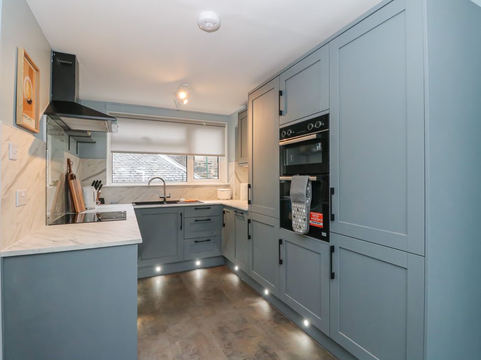 A kitchen with cabinets and an oven at Pirnie's in Pitlochry