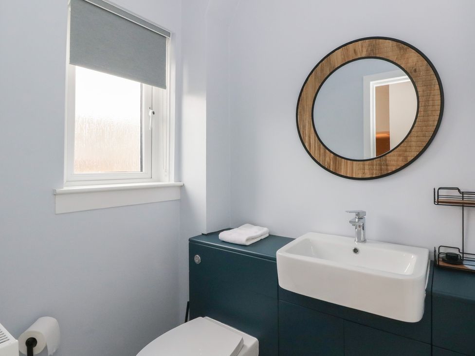 A bathroom with a sink and toilet at Pirnie's in Pitlochry