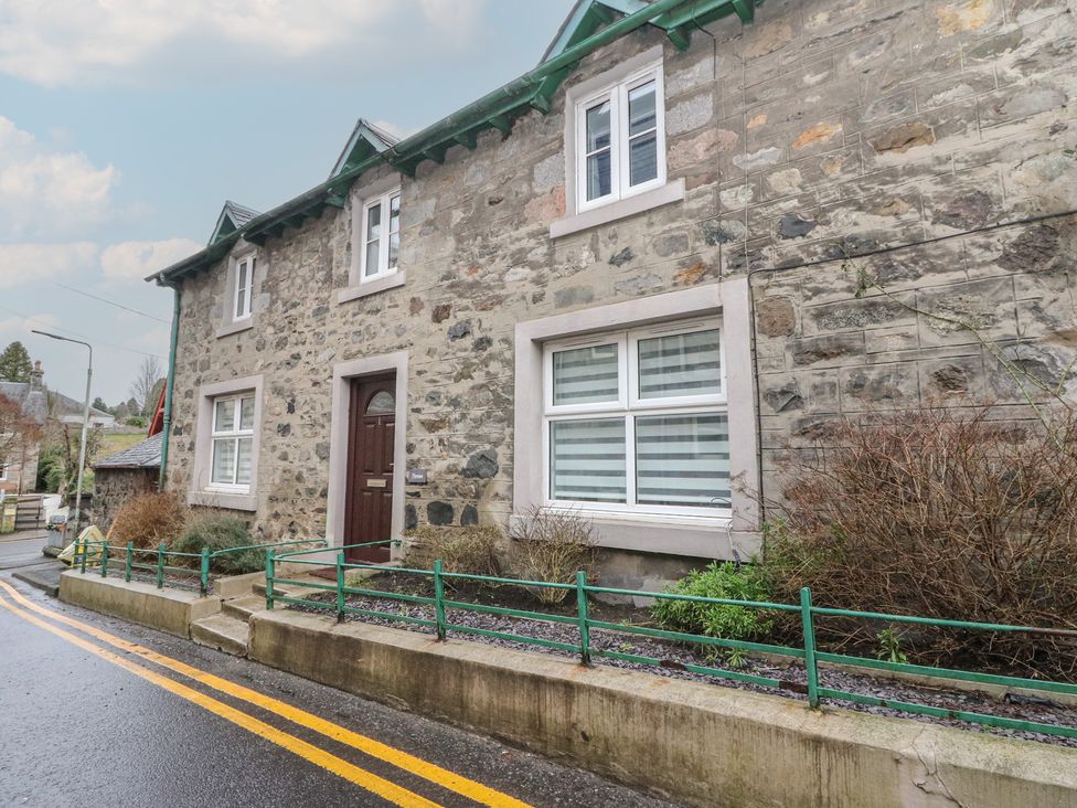 The exterior of a stone house with windows and a front door at Pirnie's Pitlochry