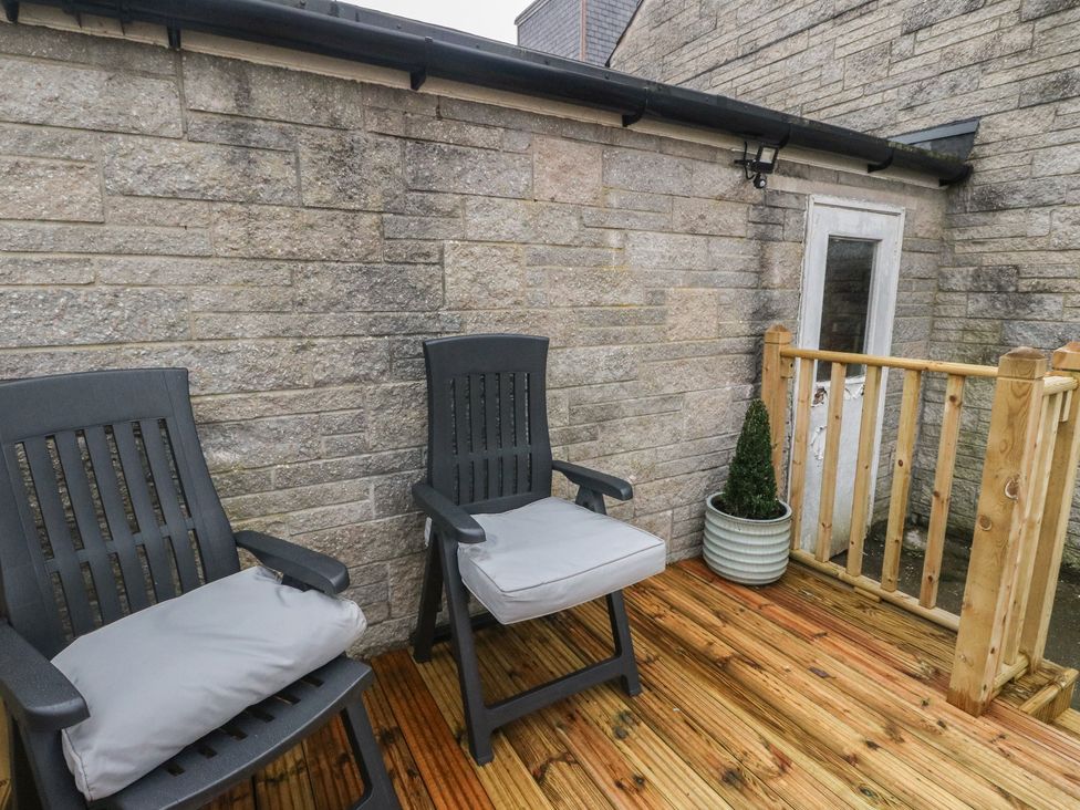 An outdoor area with two chairs and a small plant at Pirnies in Pitlochry