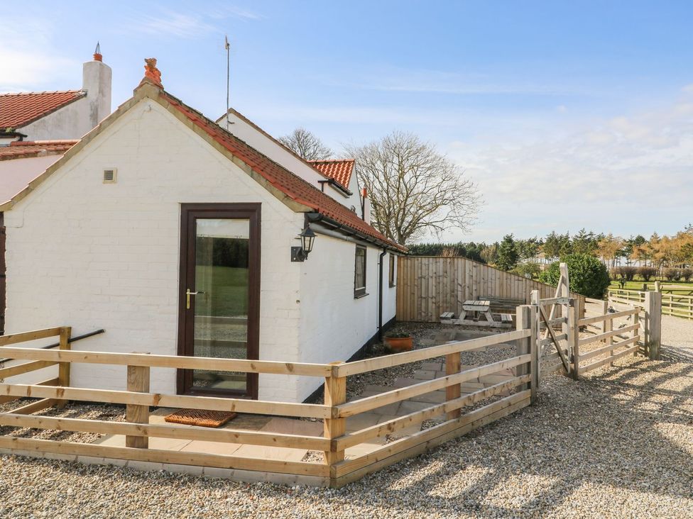 An outdoor area of a house with a fenced entrance at 1 Small in Malton