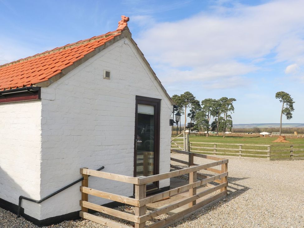 A house with a gravel area and fence at 1 Small in Malton