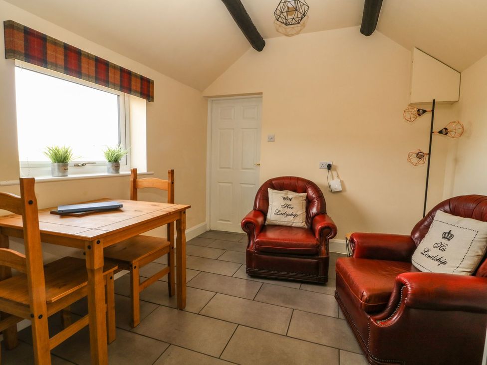 A dining room with a table and chairs at 1 Small in Malton
