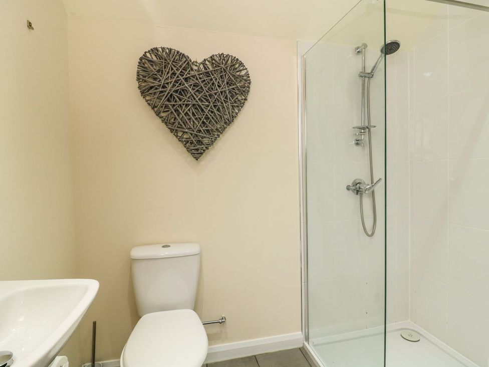 A bathroom with a shower and toilet at 1 Small in Malton