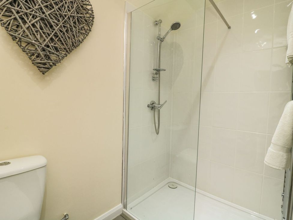 A bathroom with a shower and toilet at 1 Small in Malton