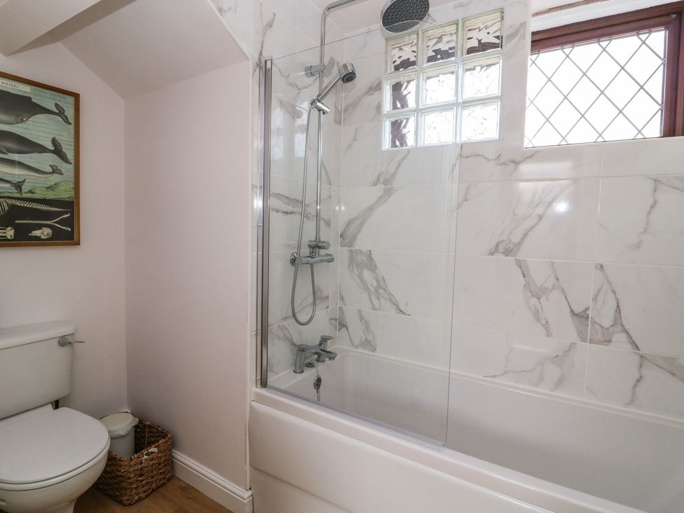 A bathroom with a bathtub and shower at 2 Jade side in Malton