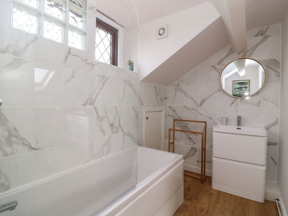 A bathroom with a bathtub and sink at 2 Jade side in Malton