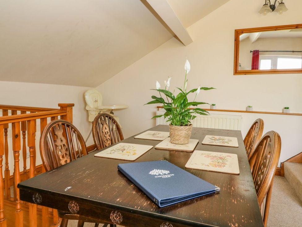 A dining room with a table and chairs at 3 Marinas side in Malton