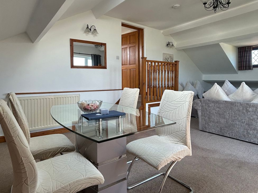 A living room with a dining table and chairs at East Cottage East Knapton near Rillington