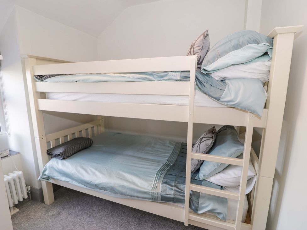 A bunk bed with two mattresses and pillows at 8 Watkin Street Conwy