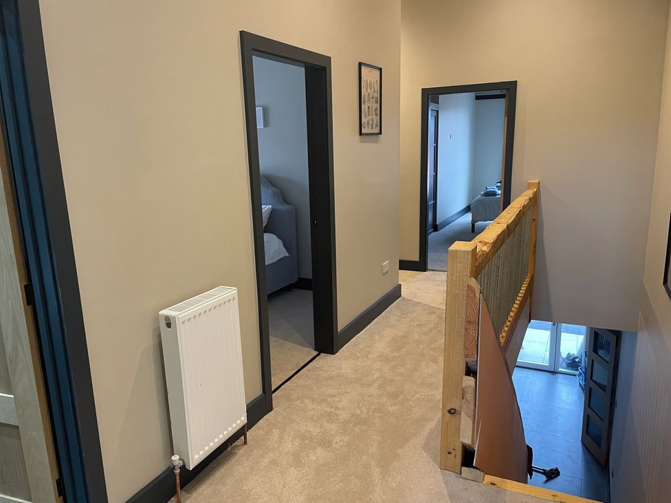A hallway with doors and a radiator at Spring Meadow in Croxdale