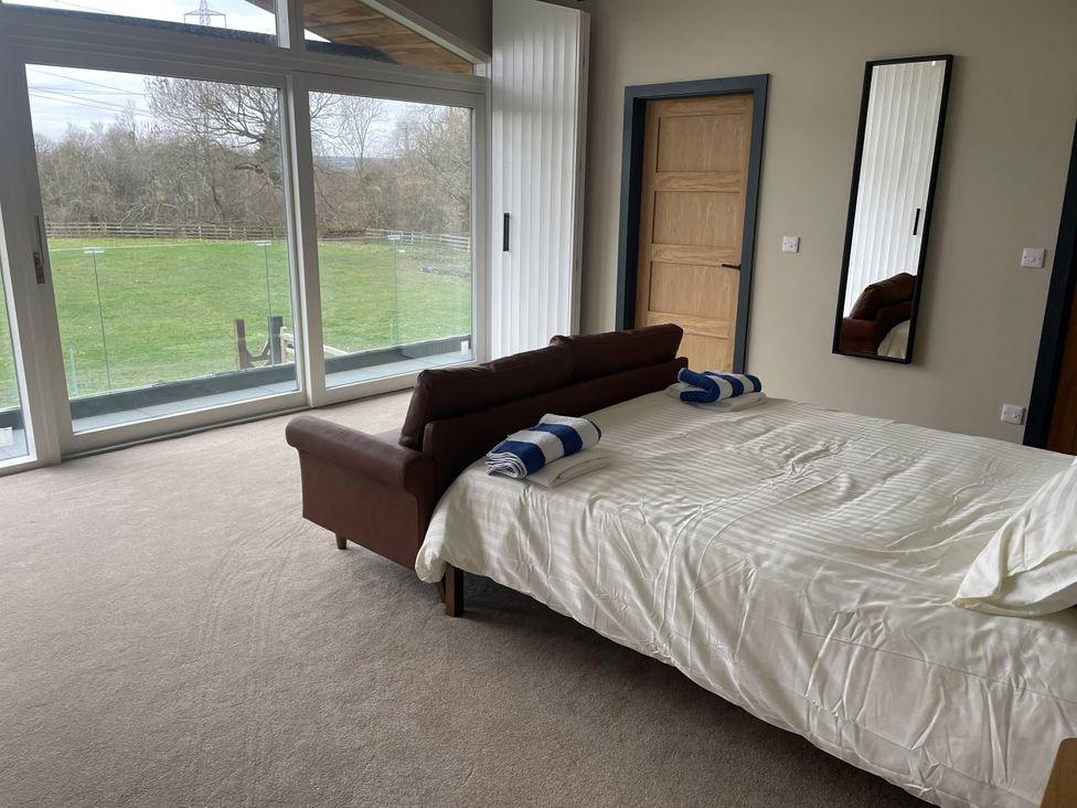 A bedroom with a bed and towels at Spring Meadow in Croxdale
