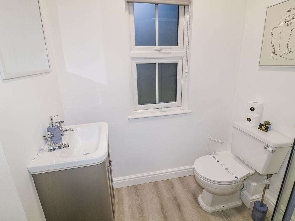 A bathroom featuring a sink and toilet at 2 in Peterborough
