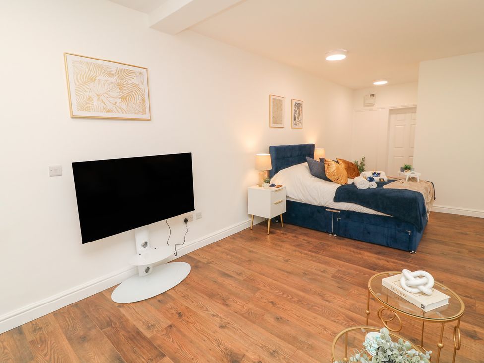 A bedroom with a bed and television at 2, Peterborough