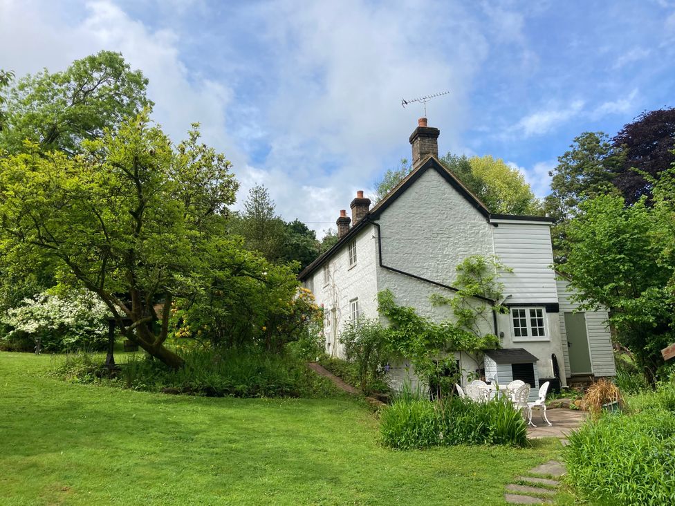 A house with garden and trees at Cherry Cottage in Crowborough