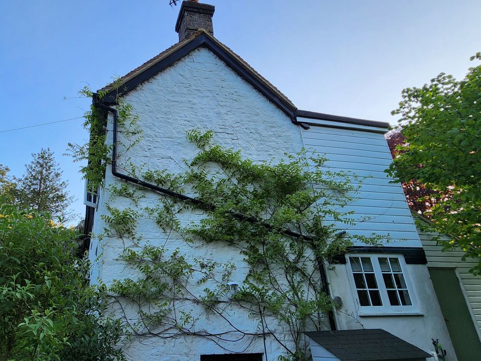 A residential house with climbing plants at Cherry Cottage in Crowborough