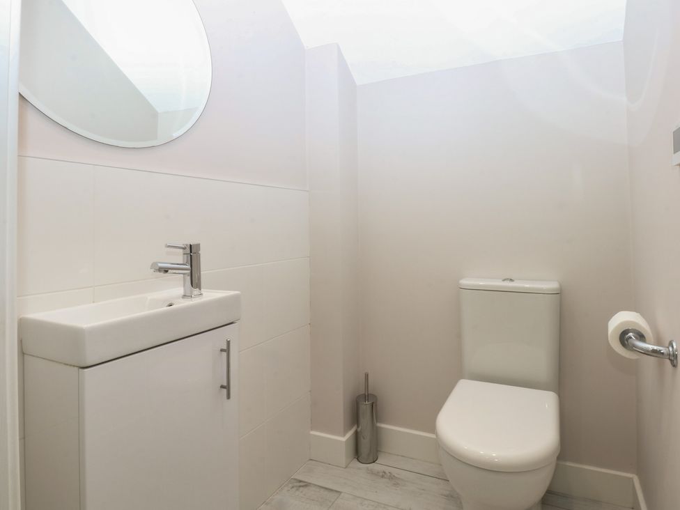 A bathroom with a sink and toilet at 2 Lon Y Dryw in Trearddur Bay
