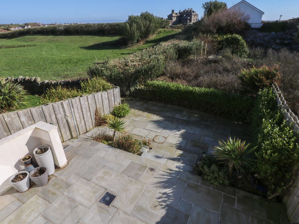 An outdoor space with paving stones and planters at 2 Lon Y Dryw, Trearddur Bay