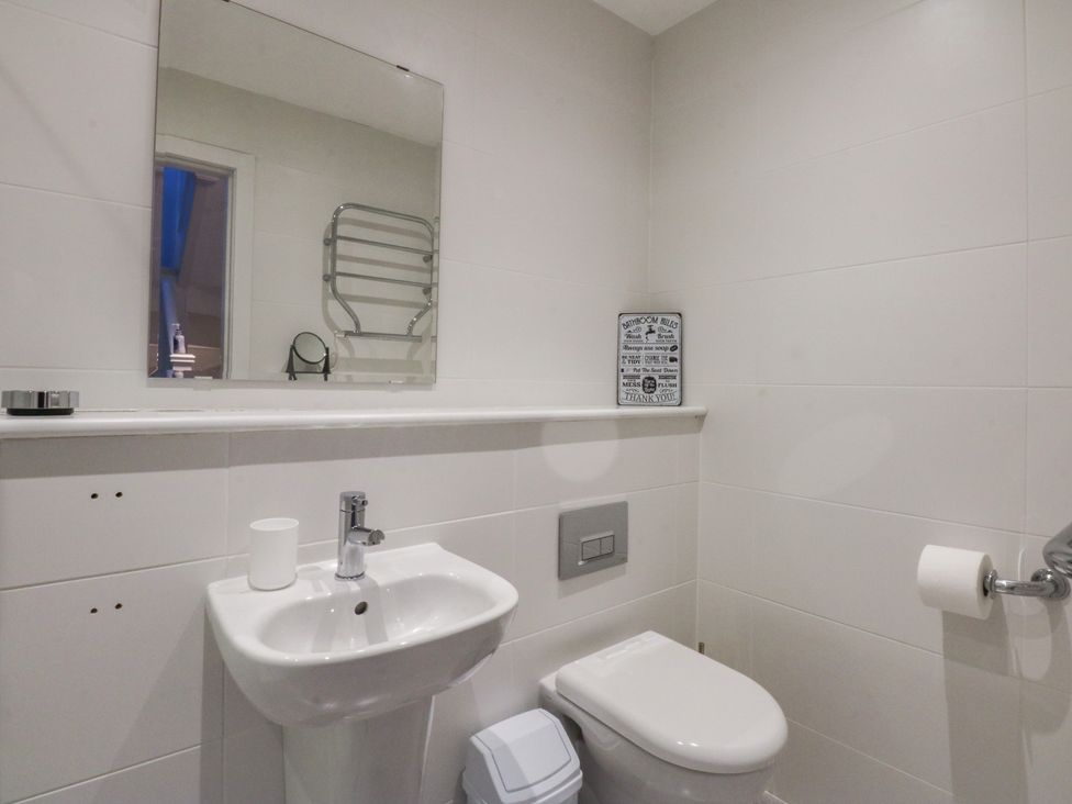 A bathroom with a sink and toilet at 2 Lon Y Dryw in Trearddur Bay