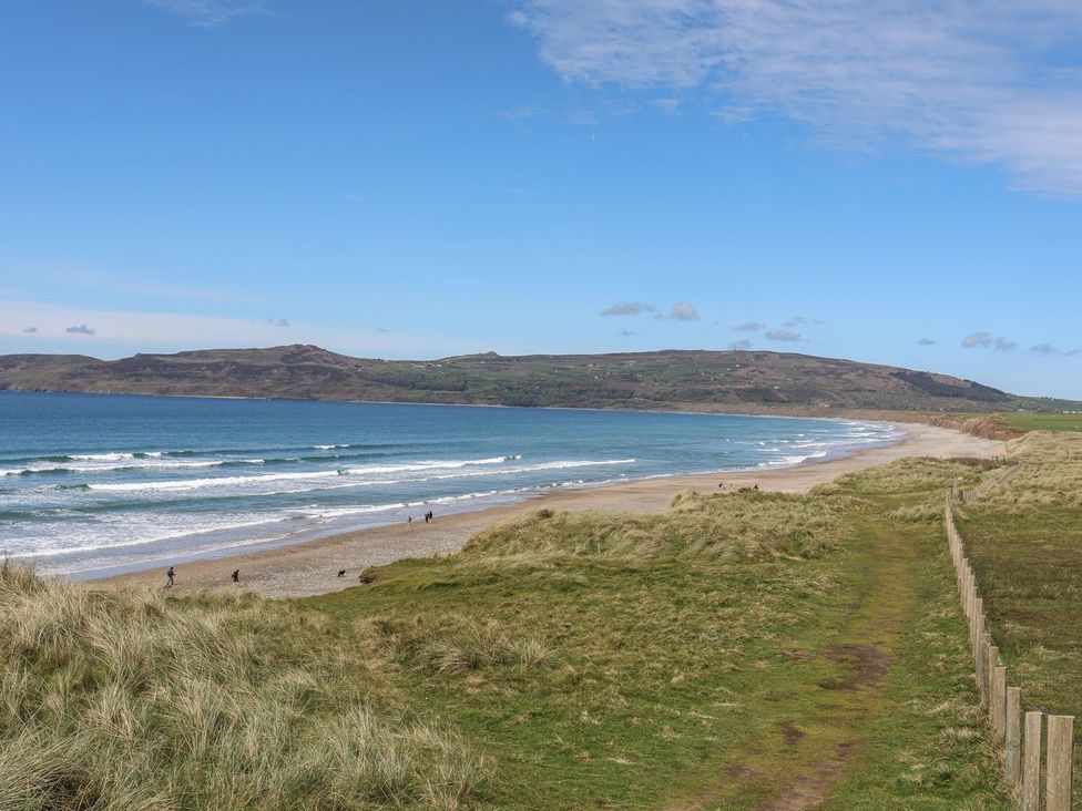 A beach with ocean waves and a path at Rhiw - 1 Ty'n Don Abersoch