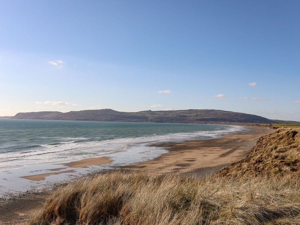 A beach view with sand and sea at Ceiriad - 9 Ty'n Don Llanengan near Abersoch