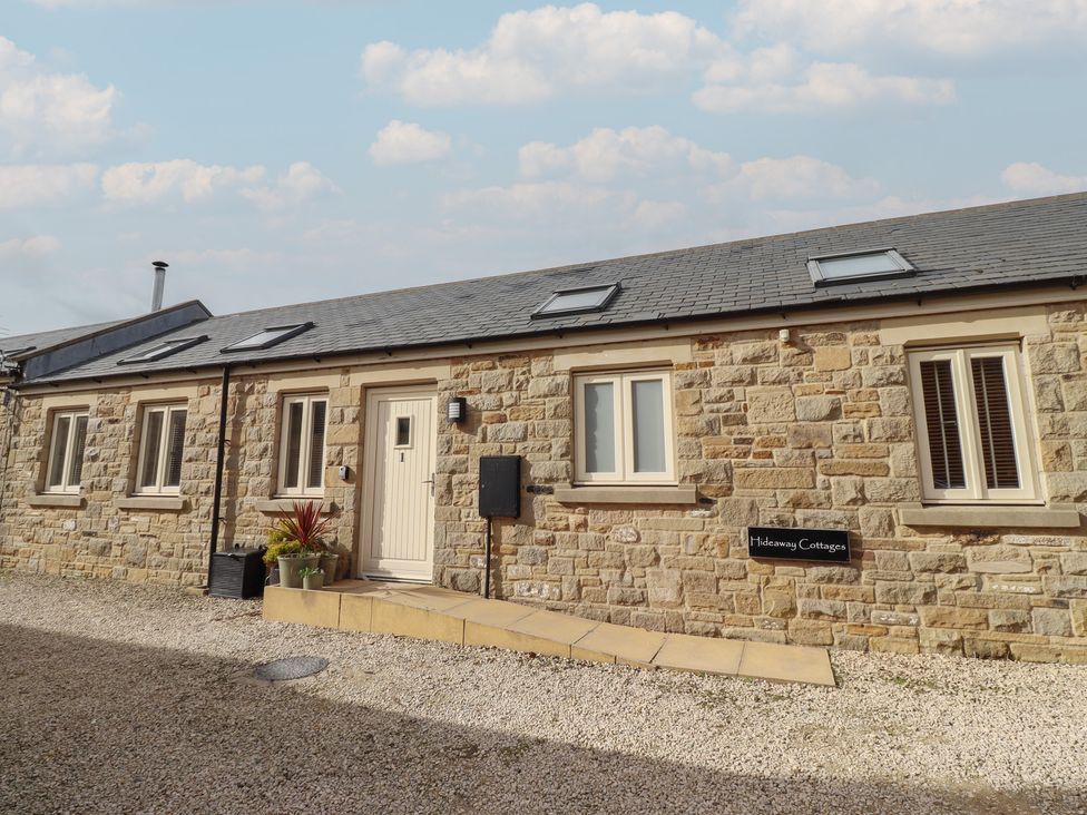 An exterior view of a cottage named Hideaway Cottage No 1 in Seahouses