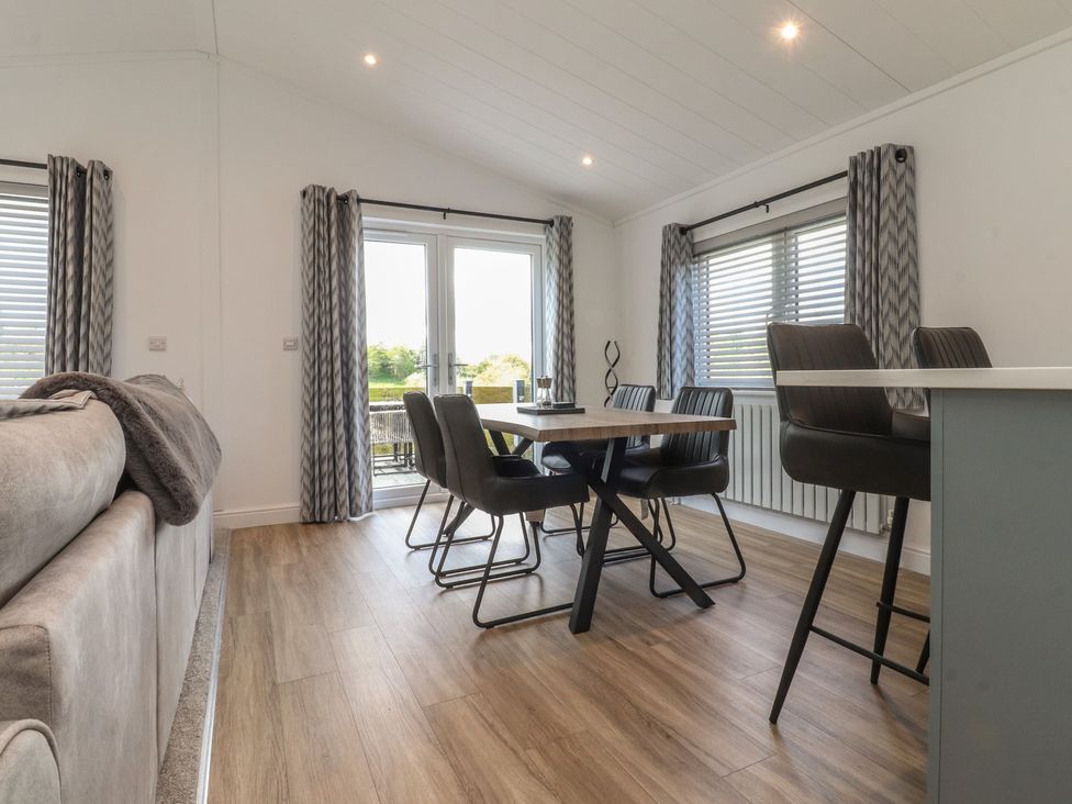 A dining room with a table and chairs at Number 35