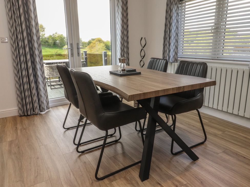 A dining room with a table and chairs at Number 35