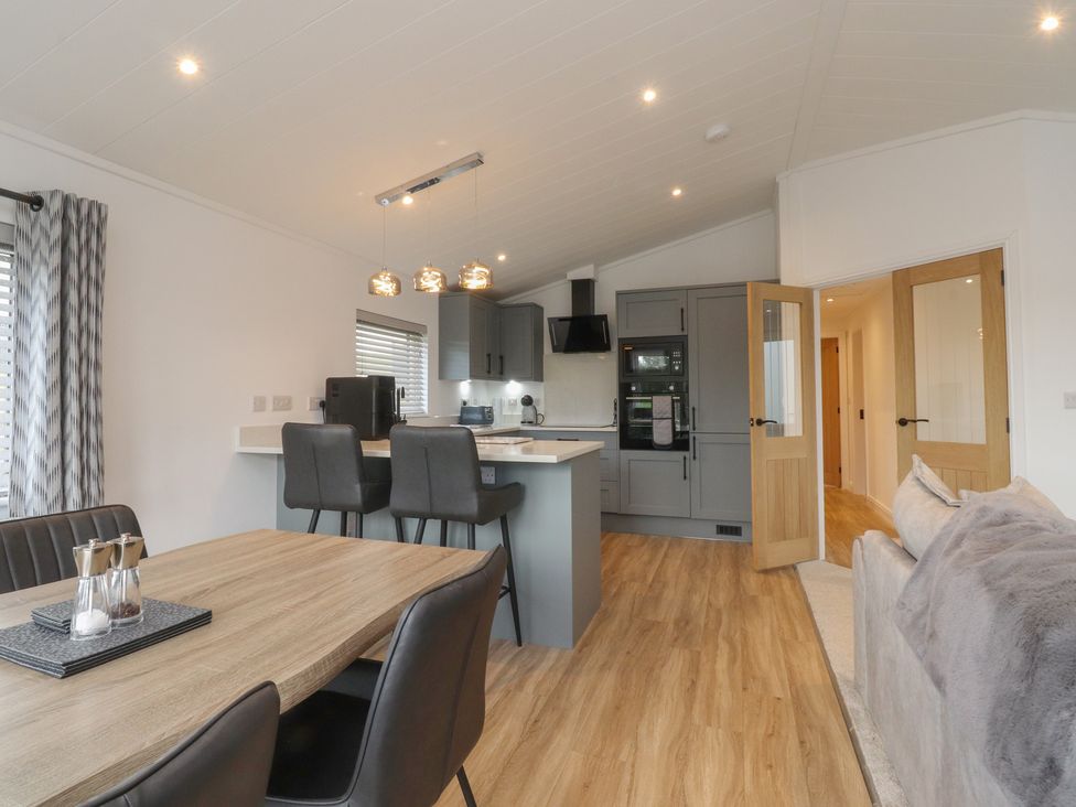 A kitchen with dining table and chairs at Number 35