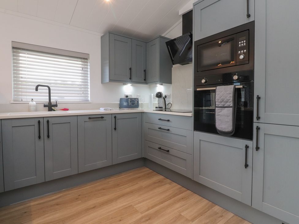 A kitchen with cabinets and appliances at Number 35